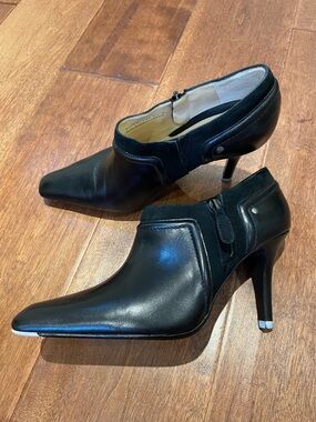 Black leather stiletto mini boots